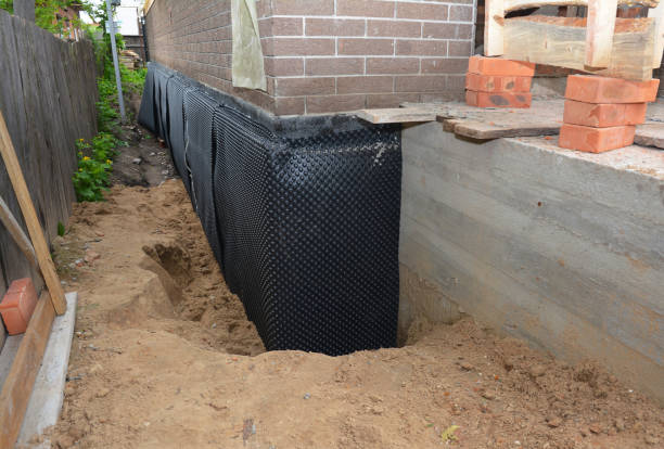 Happy homeowners after waterproofing job in Fort Thomas